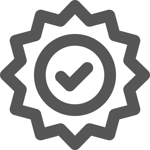 A gray circular badge with a starburst edge design, featuring a check mark inside the circle.